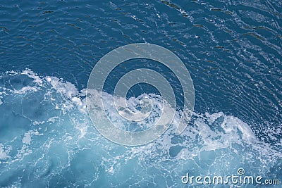 Sea â€‹â€‹water with foam, movement of the water after the passage of a boat Stock Photo
